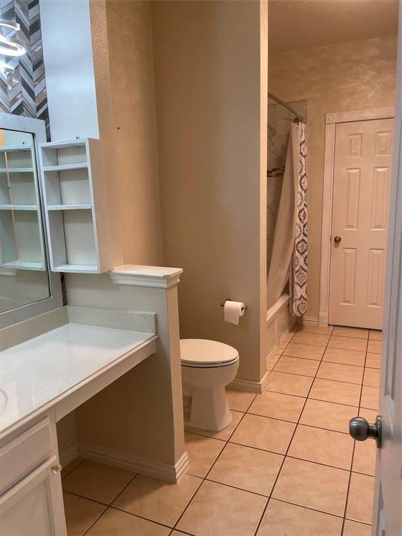 1004 Concan Drive Forney, TX 75126 - Photo 13 of 24 a bathroom with a sink and a toilet