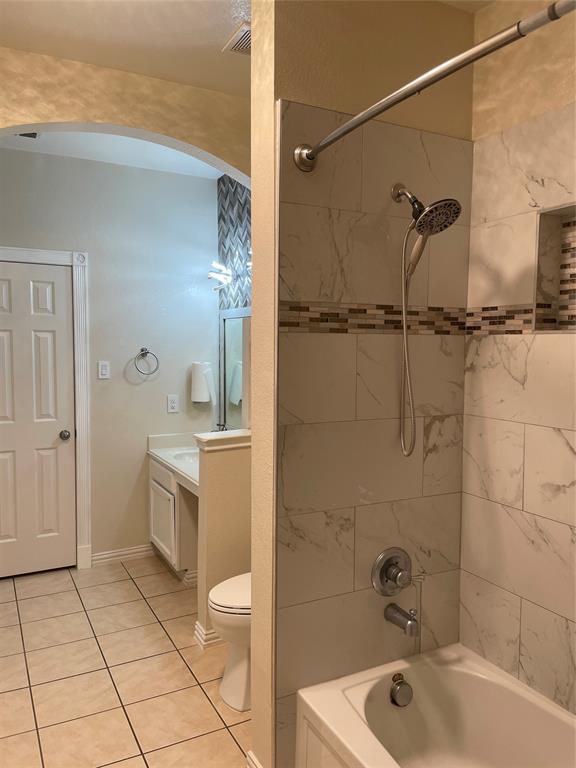 1004 Concan Drive Forney, TX 75126 - Photo 14 of 24 a bathroom with a sink a toilet and shower