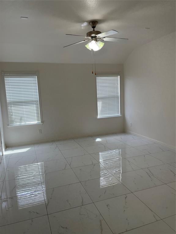 1004 Concan Drive Forney, TX 75126 - Photo 17 of 24 a view of an empty room with a window