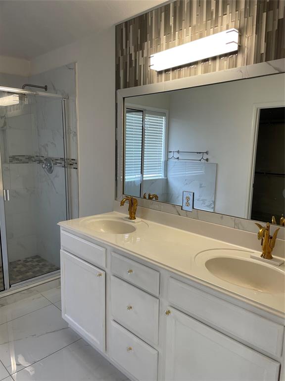 1004 Concan Drive Forney, TX 75126 - Photo 21 of 24 a bathroom with a sink and a mirror