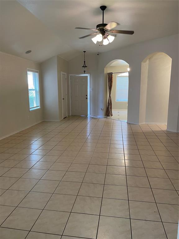 1004 Concan Drive Forney, TX 75126 - Photo 5 of 24 a view of a livingroom with a chandelier fan and windows