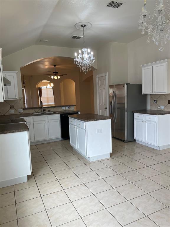 1004 Concan Drive Forney, TX 75126 - Photo 9 of 24 a kitchen with stainless steel appliances granite countertop a refrigerator a stove and a sink