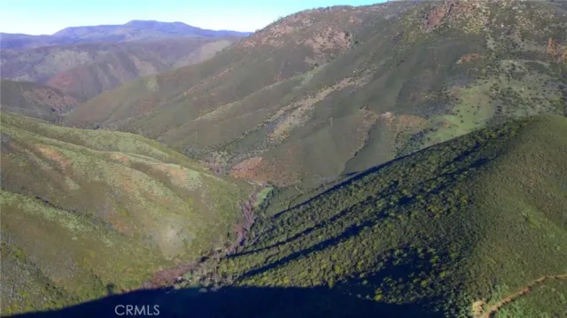 a view of a street with a mountain in the background