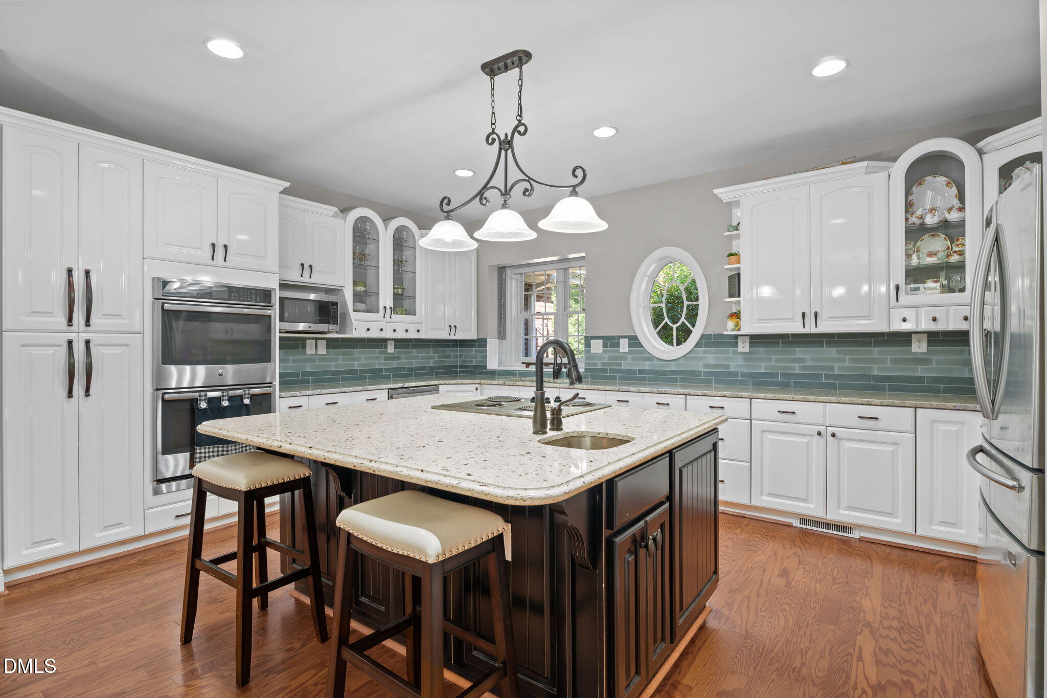 5870 Hoyt Road Middlesex, NC 27557 - Photo 3 of 33 a kitchen with center island table and chairs