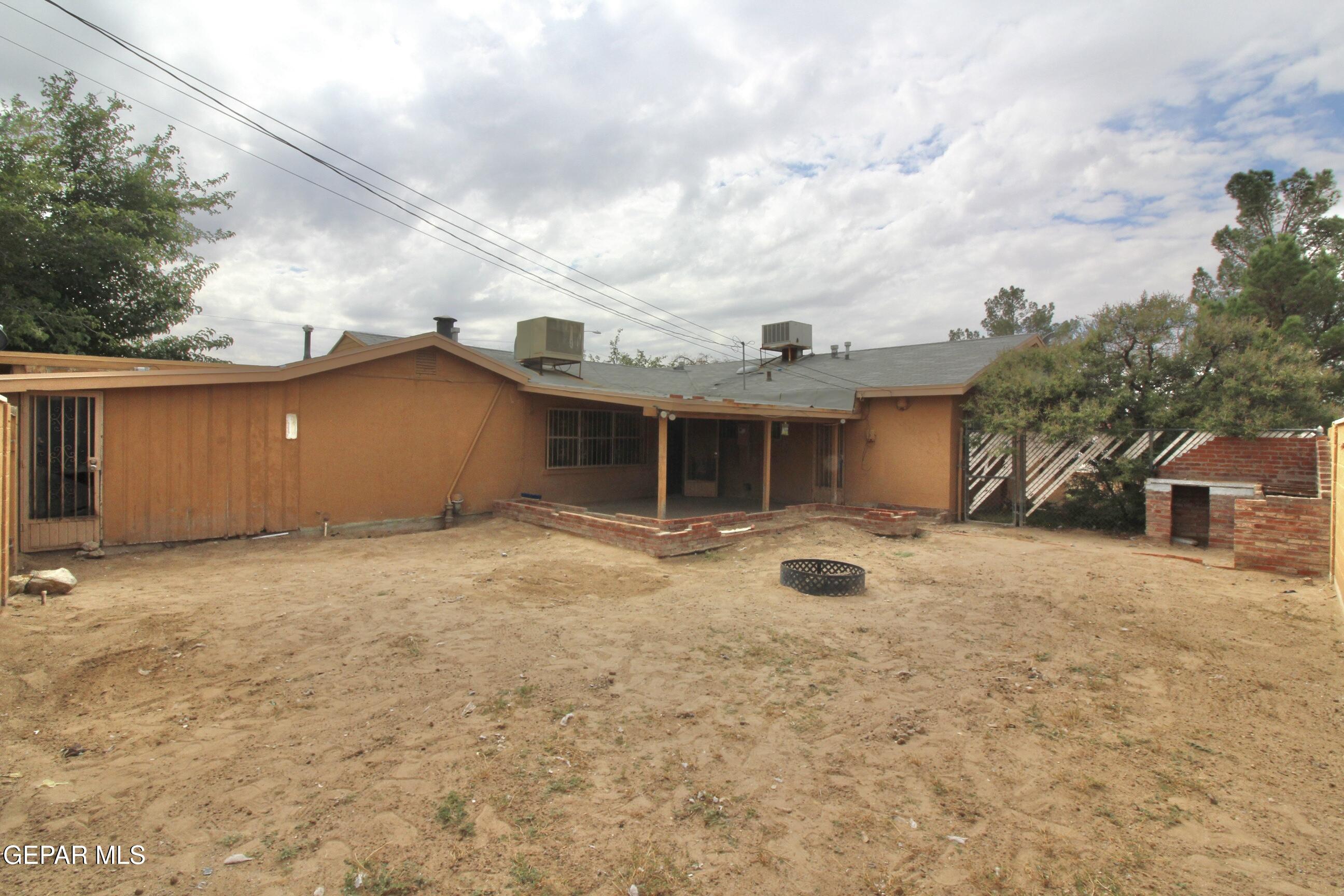 525 Margarita Street Anthony, TX 79821 - Photo 12 of 20 a view of a house with backyard and garage