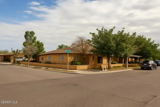 a view of street with parked cars