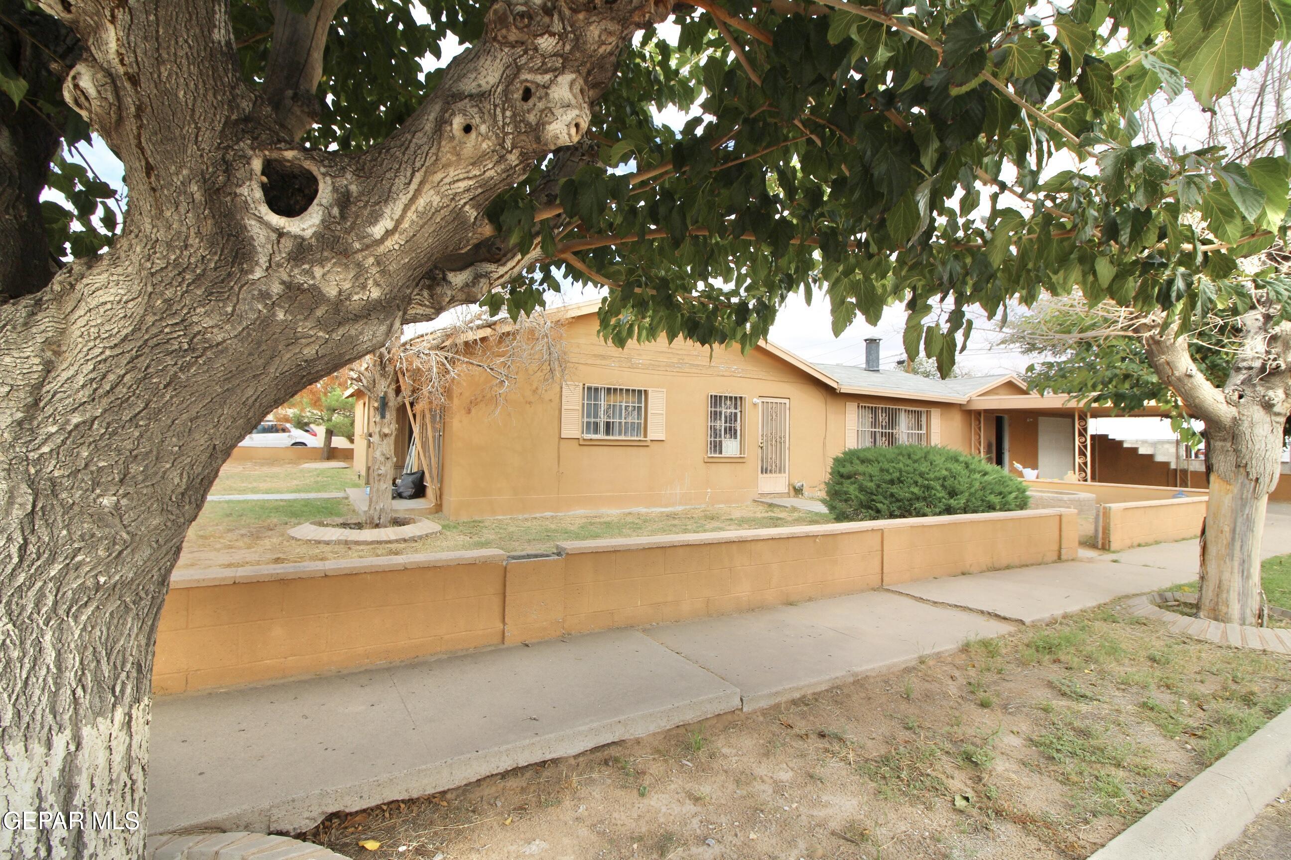 525 Margarita Street Anthony, TX 79821 - Photo 3 of 20 a view of a house with a tree