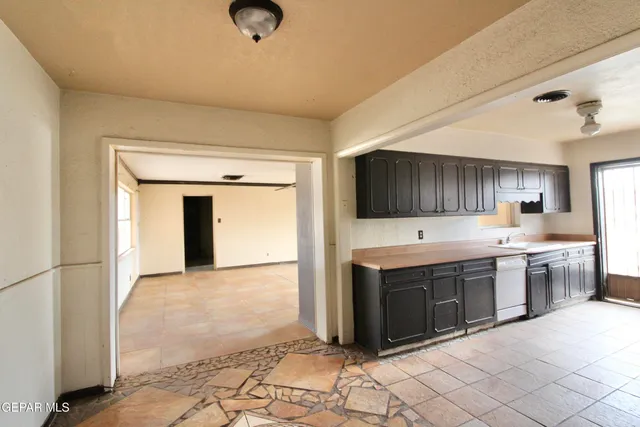 a kitchen with stainless steel appliances granite countertop a sink and cabinets