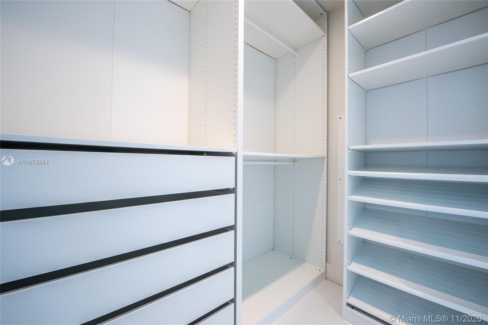 The Bond Miami, FL 33131 - Photo 8 of 19 a view of walk in closet with empty racks