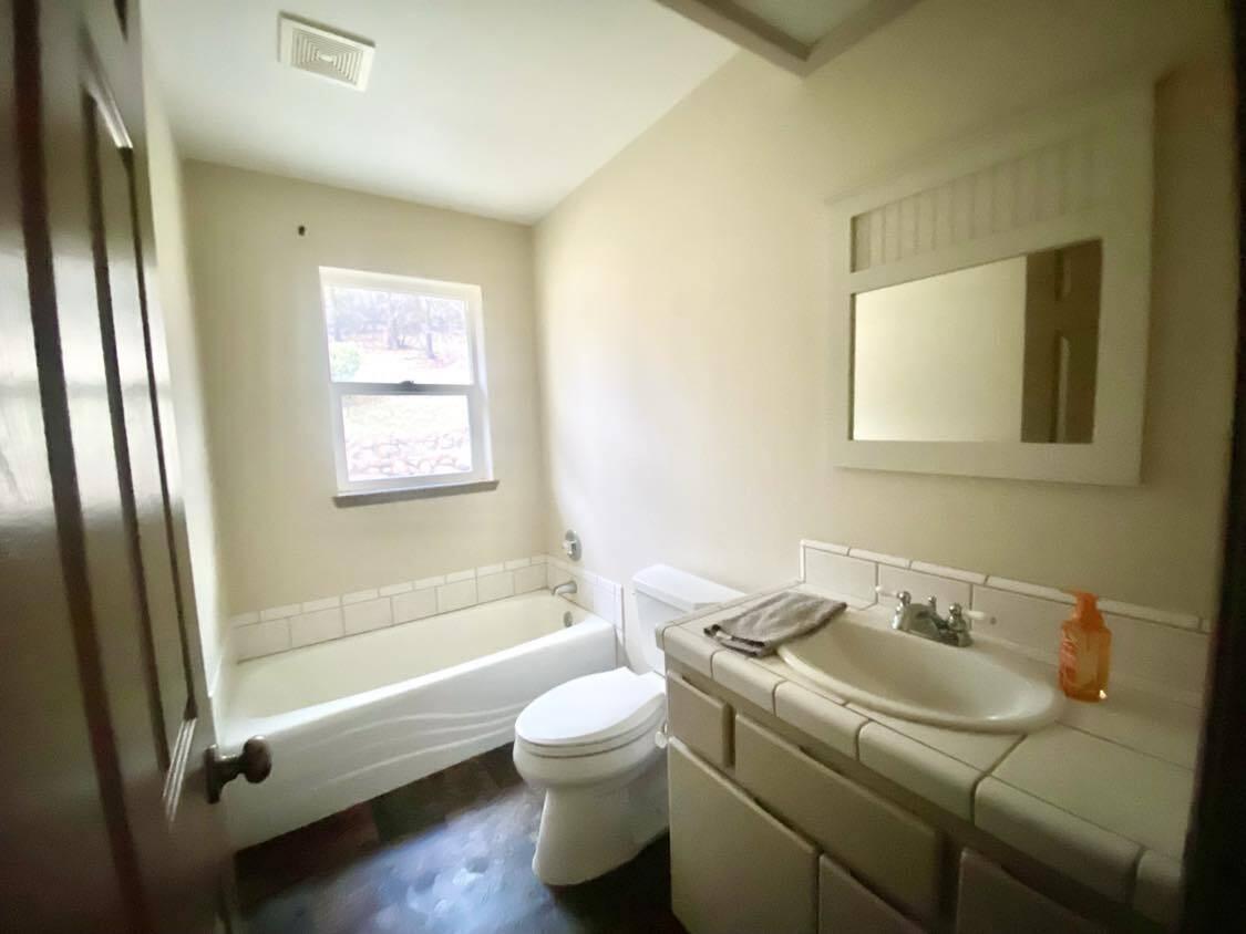 13080 Fern Road Whitmore, CA 96096 - Photo 33 of 49 a bathroom with a sink toilet and shower