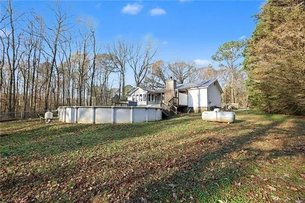 a view of a house with a yard