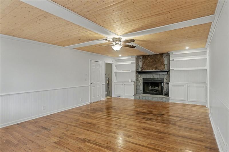 3800 Tyus Carrollton Road Carrollton, GA 30117 - Photo 6 of 36 a view of empty room with wooden floor and fireplace