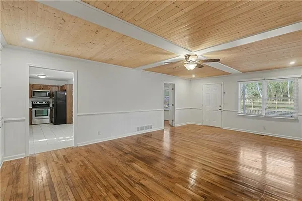 a view of an empty room with a window