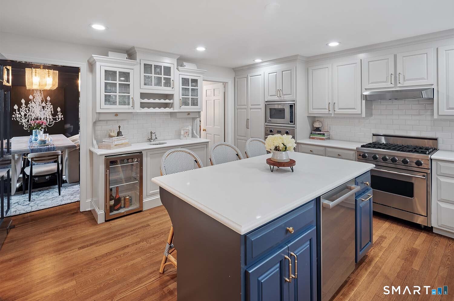 775 Sasco Hill Road Fairfield, CT 06824 - Photo 8 of 36 a kitchen with a stove cabinets and wooden floor