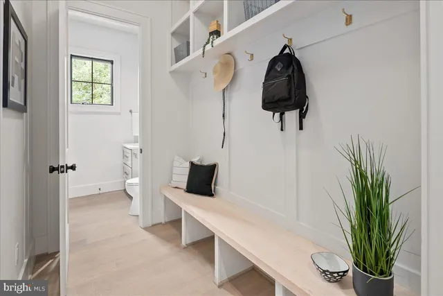 a spacious bathroom with a double vanity sink a mirror and a bathtub