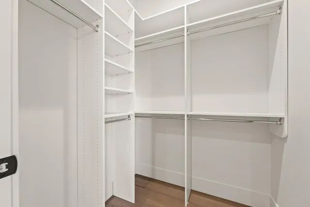 a view of a hallway to rooms