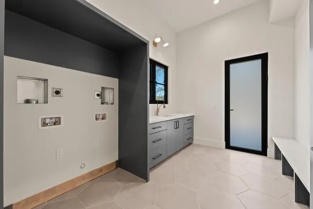 a kitchen with a sink and cabinets