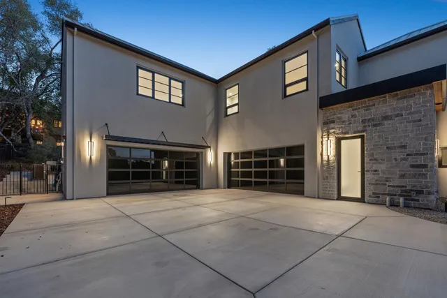 an aerial view of a house with a yard sitting space