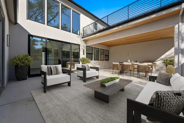 a view of a house with yard and sitting area