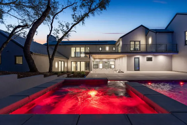 an aerial view of a golf course with chairs