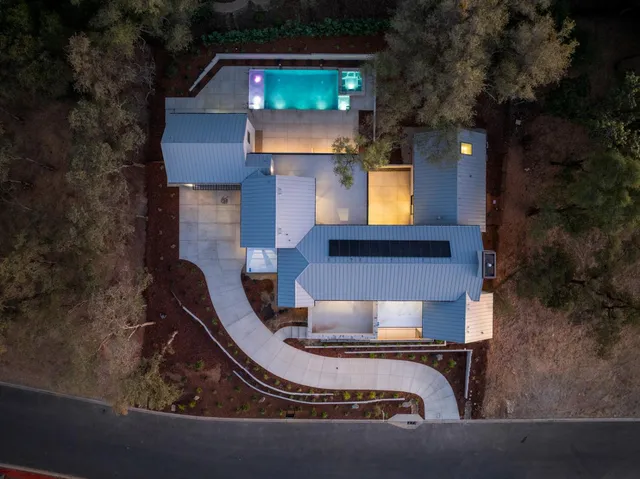 a view of a dining room with furniture and window