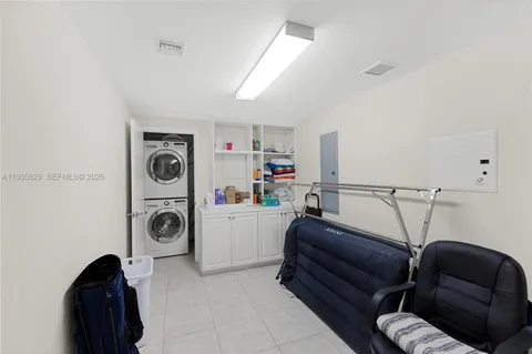 a bedroom with furniture and a closet