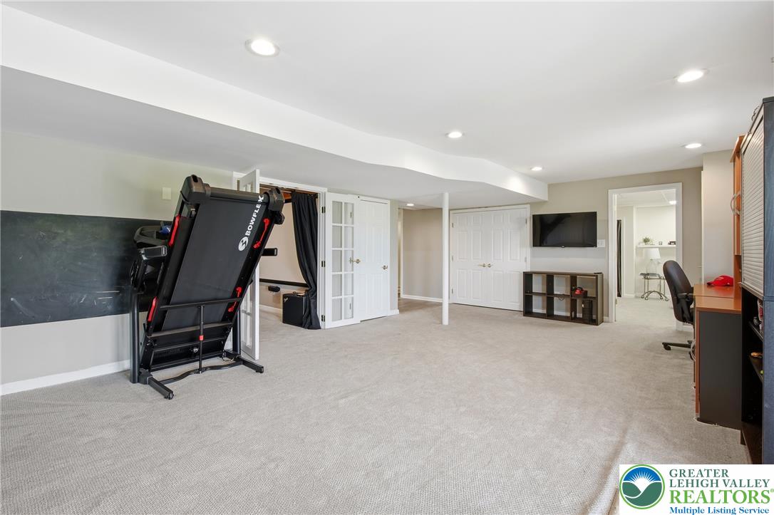 115 West Butternut Road Hellertown, PA 18055 - Photo 59 of 97 A versatile recreation room with neutral tones, bright lighting, and ample space for various activities.