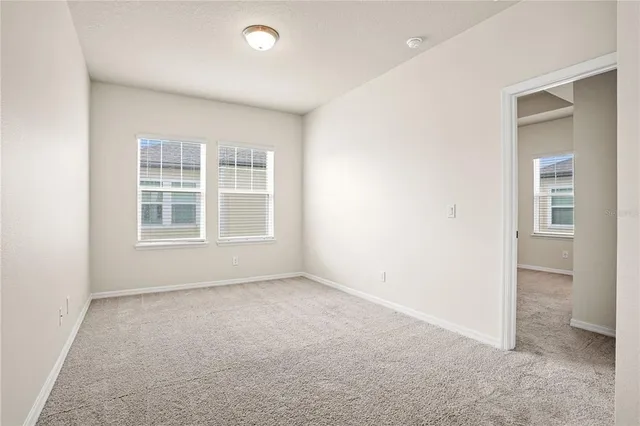 an empty room with windows