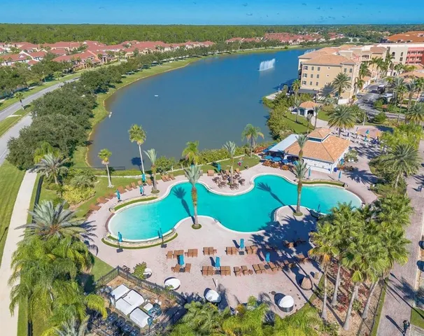 an aerial view of a house yard and ocean view
