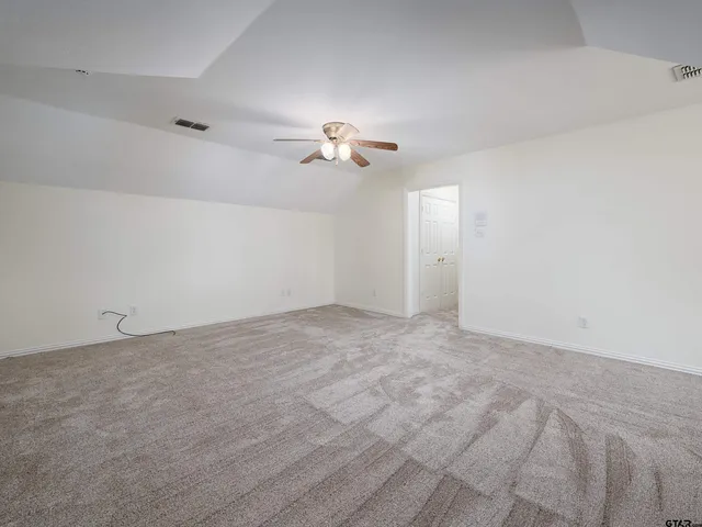 a view of a big room with carpet