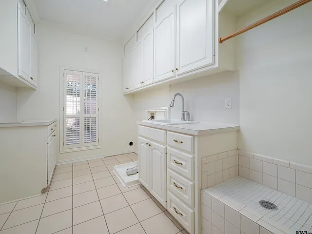 a kitchen with cabinets and appliances