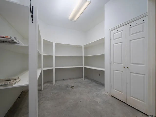 a view of an empty walk in closet