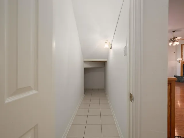 a view of an empty room with a fireplace