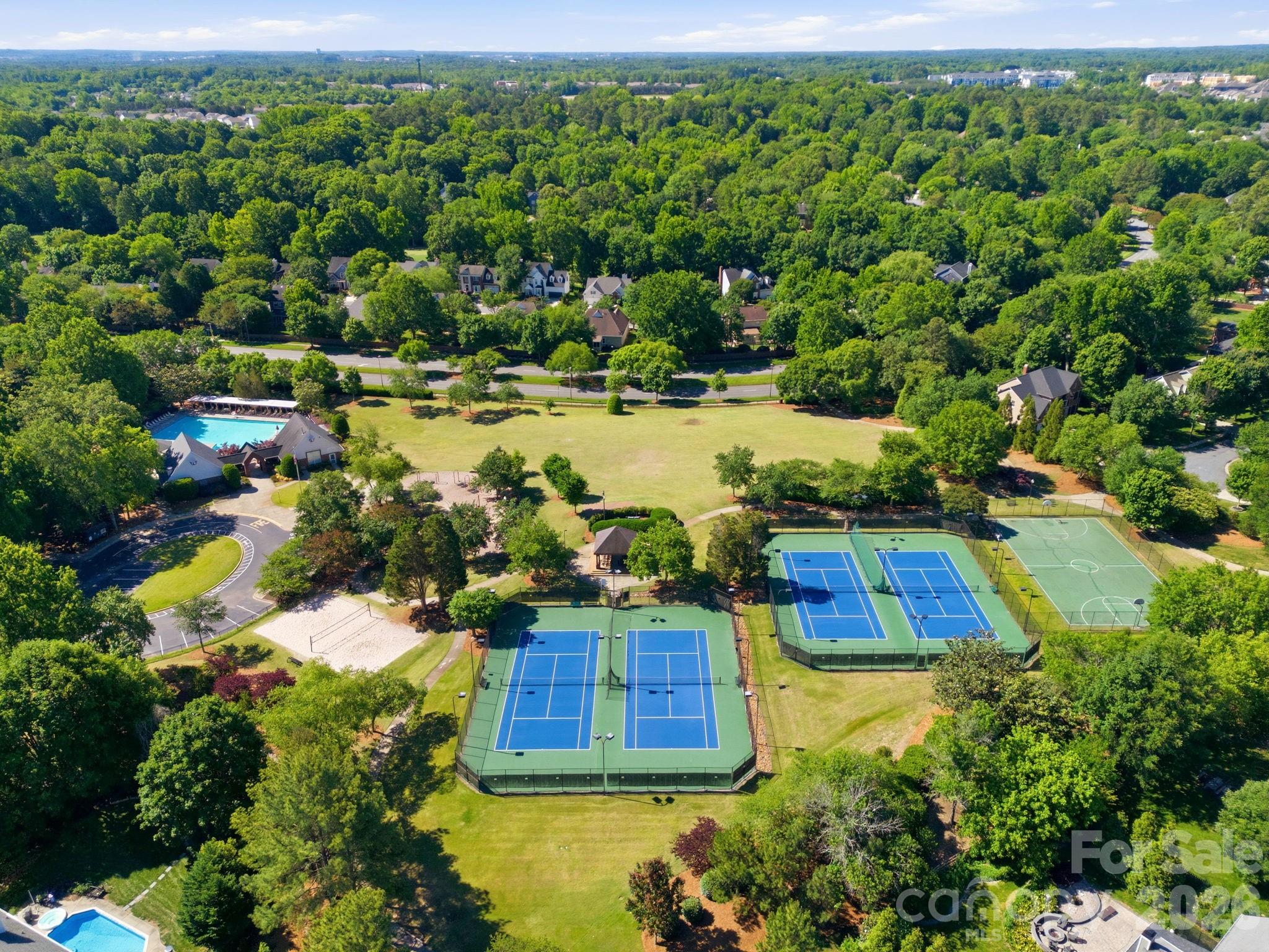 3308 Grandeur Road Charlotte, NC 28269 - Photo 45 of 45 an aerial view of a house with a yard and lake view