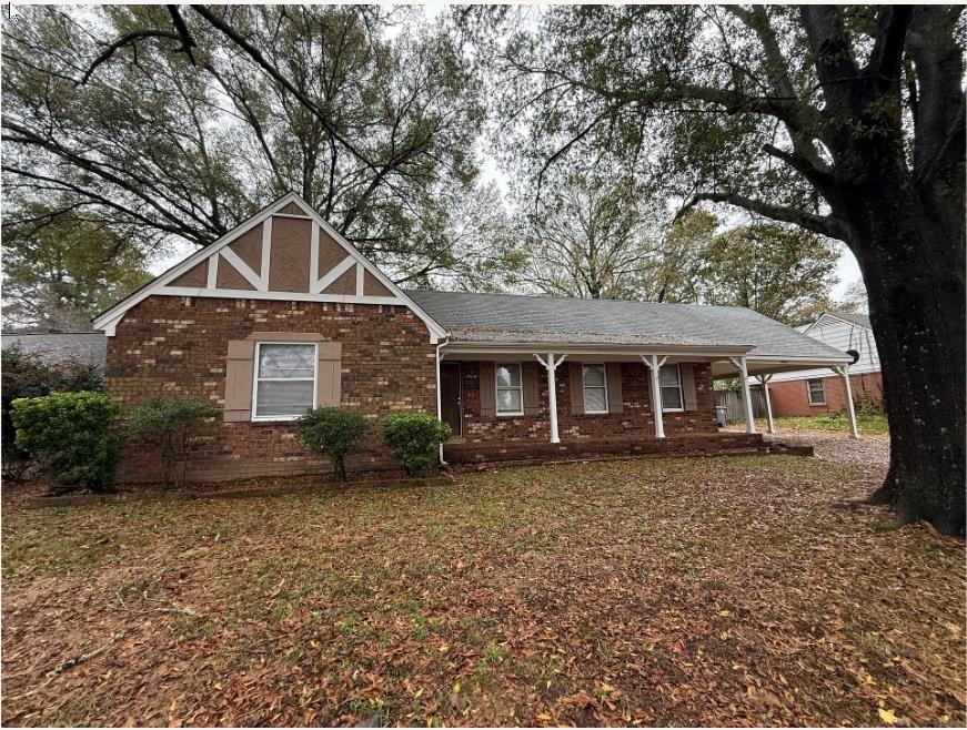 5355 Rock Ridge Road South Memphis, TN 38134 - Photo 1 of 12 front view of a house with a yard