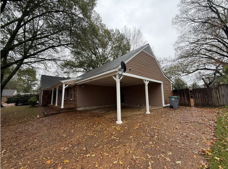5355 Rock Ridge Road South Memphis, TN 38134 - Photo 2 of 12 front view of a house with a yard