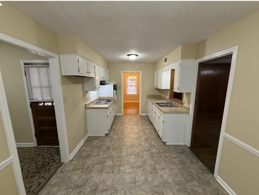 5355 Rock Ridge Road South Memphis, TN 38134 - Photo 3 of 12 a kitchen with granite countertop a refrigerator stove and sink