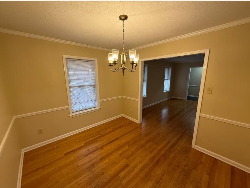 5355 Rock Ridge Road South Memphis, TN 38134 - Photo 4 of 12 a view of a room with wooden floor chandelier and a window