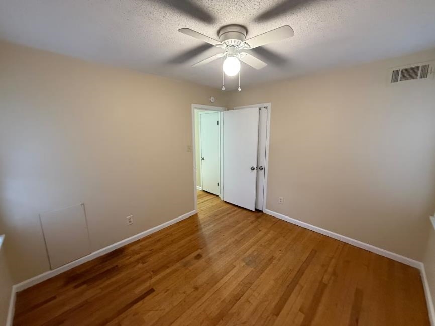 5355 Rock Ridge Road South Memphis, TN 38134 - Photo 8 of 12 wooden floor in an empty room