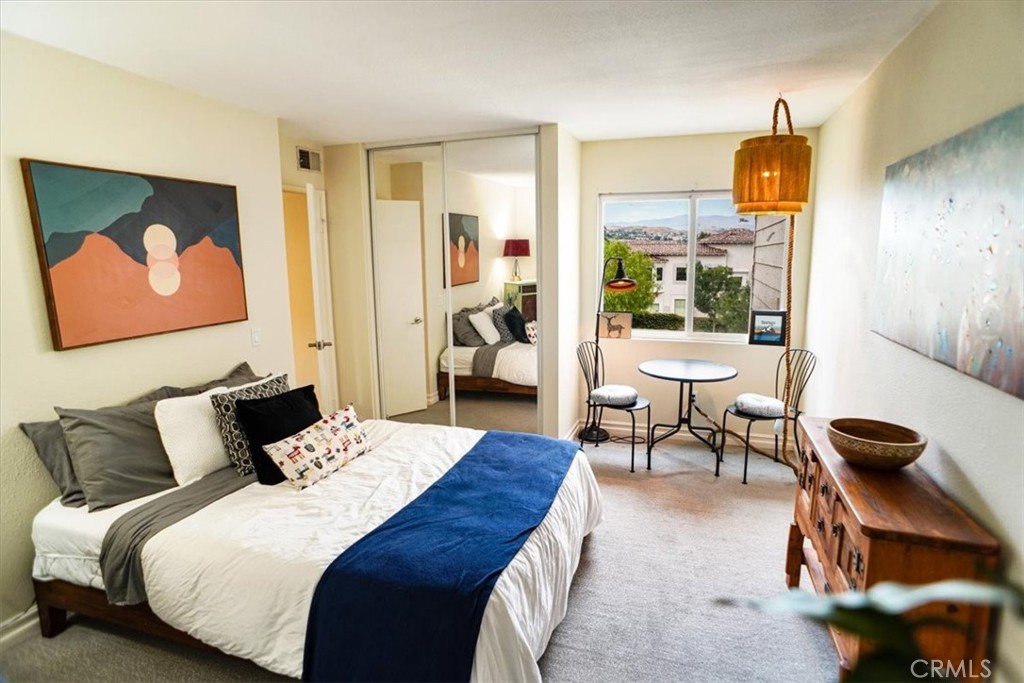 31311 The Old Road, Unit E Castaic, CA 91384 - Photo 12 of 19 a bedroom with a bed and wooden floor