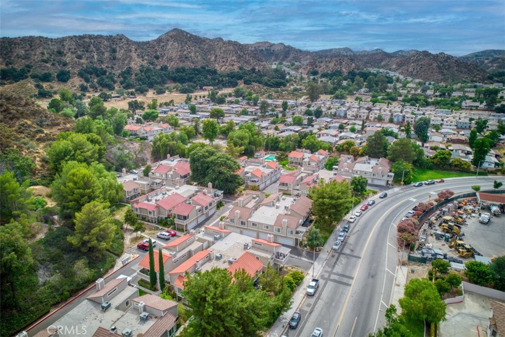 31311 The Old Road, Unit E Castaic, CA 91384 - Photo 16 of 19 an aerial view of a city with lots of residential buildings