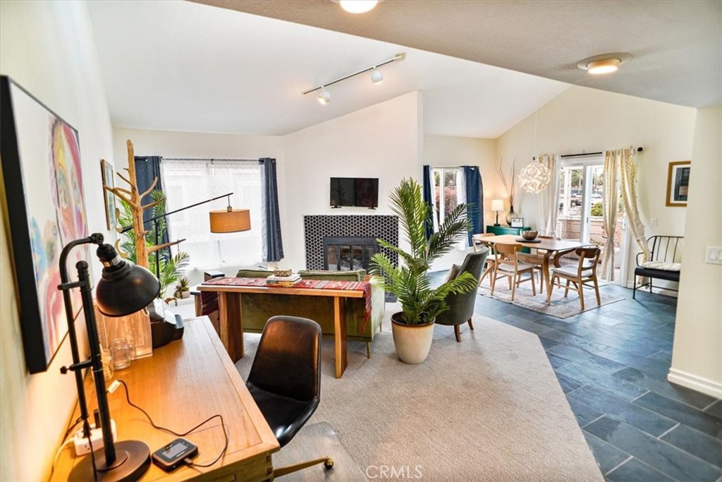 31311 The Old Road, Unit E Castaic, CA 91384 - Photo 5 of 19 a living room with furniture a rug and a flat screen tv