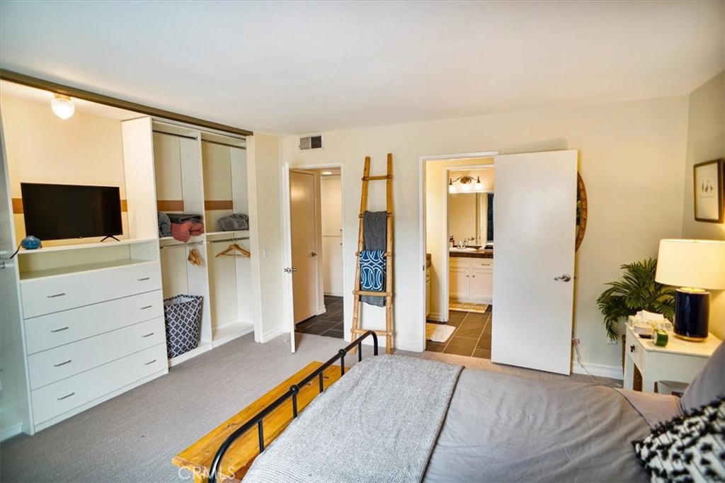 31311 The Old Road, Unit E Castaic, CA 91384 - Photo 9 of 19 a bedroom with furniture and a flat screen tv