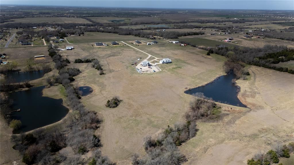 1408 Hackberry Road Van Alstyne, TX 75495 - Photo 3 of 6 an aerial view of residential houses with outdoor space
