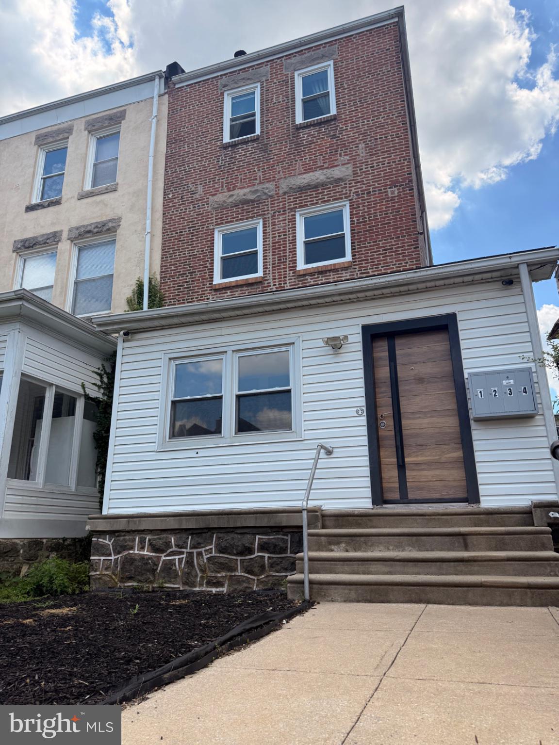 822 Wynnewood Road, Unit 1 Philadelphia, PA 19151 - Photo 2 of 16 a side view of a house