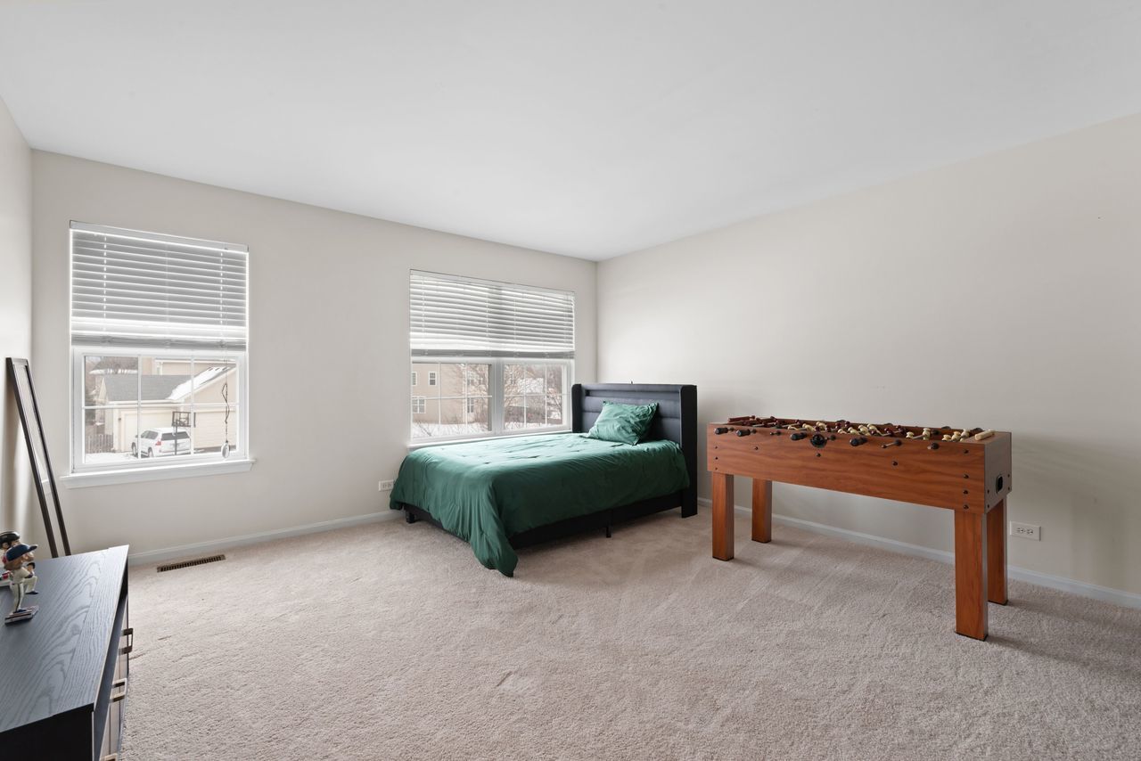 2561 Hennig Road Hampshire, IL 60140 - Photo 16 of 36 a bedroom with a bed and a window