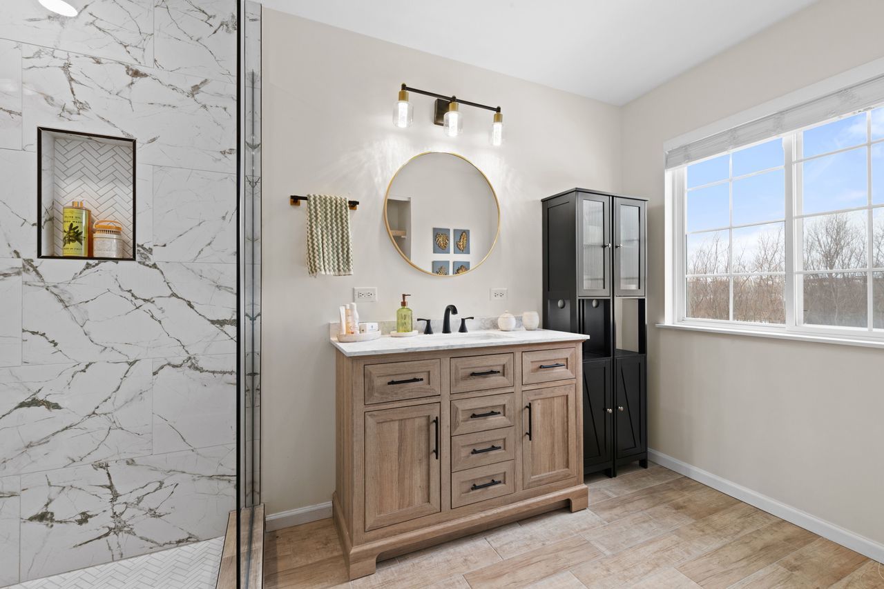 2561 Hennig Road Hampshire, IL 60140 - Photo 21 of 36 a bathroom with a double vanity sink mirror and shower