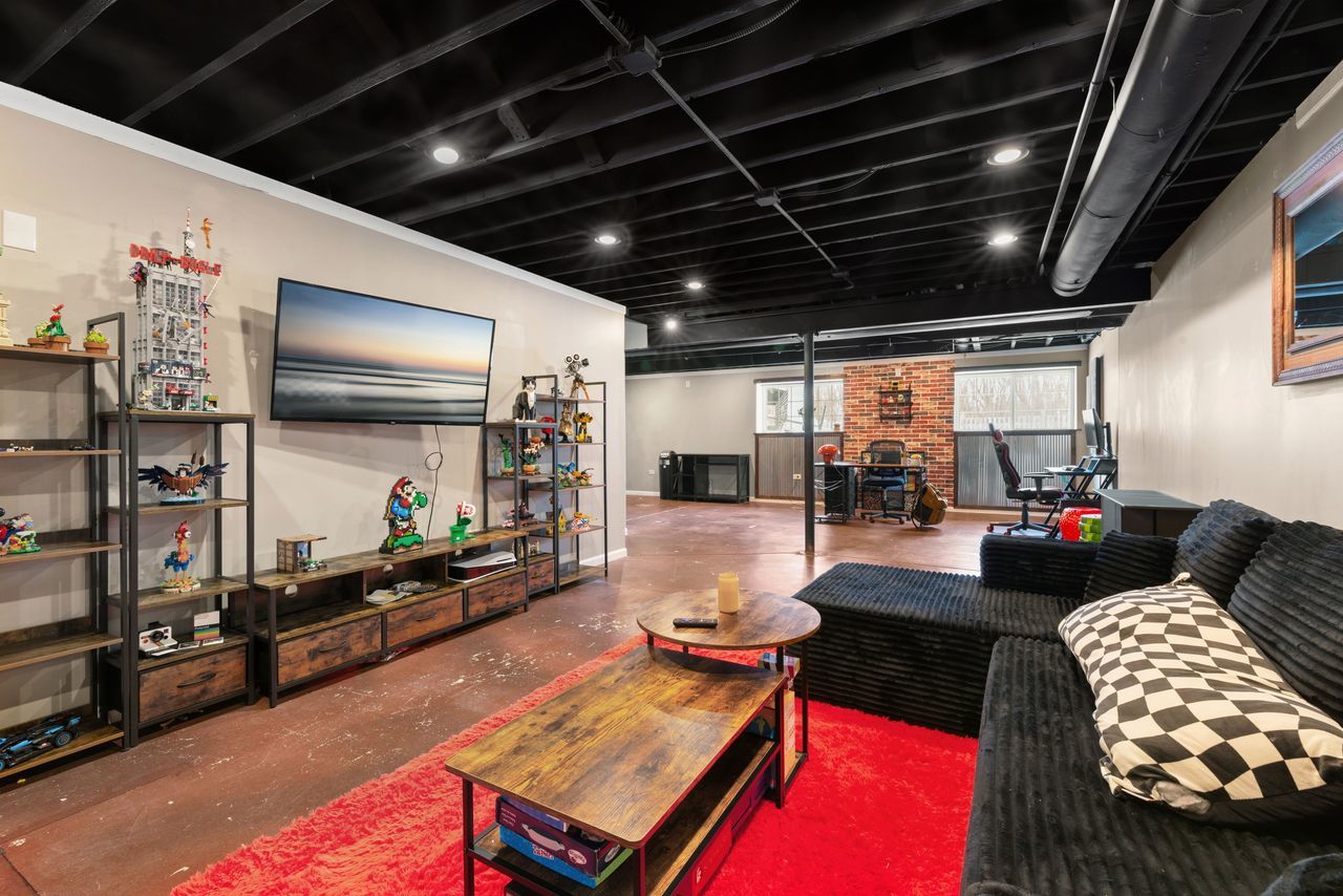 2561 Hennig Road Hampshire, IL 60140 - Photo 25 of 36 a living room with furniture and a flat screen tv