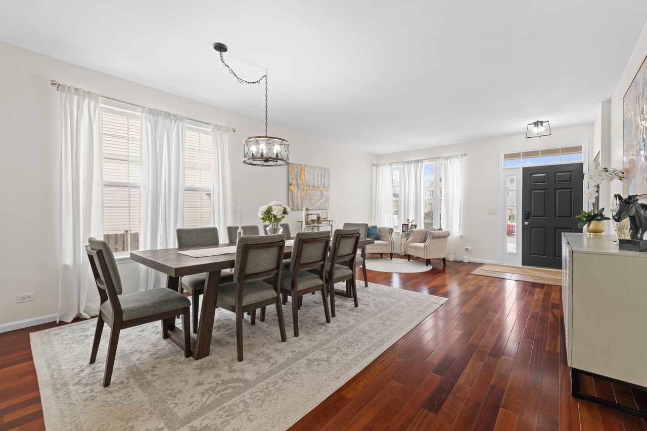 2561 Hennig Road Hampshire, IL 60140 - Photo 4 of 36 a view of a dining room with furniture and wooden floor