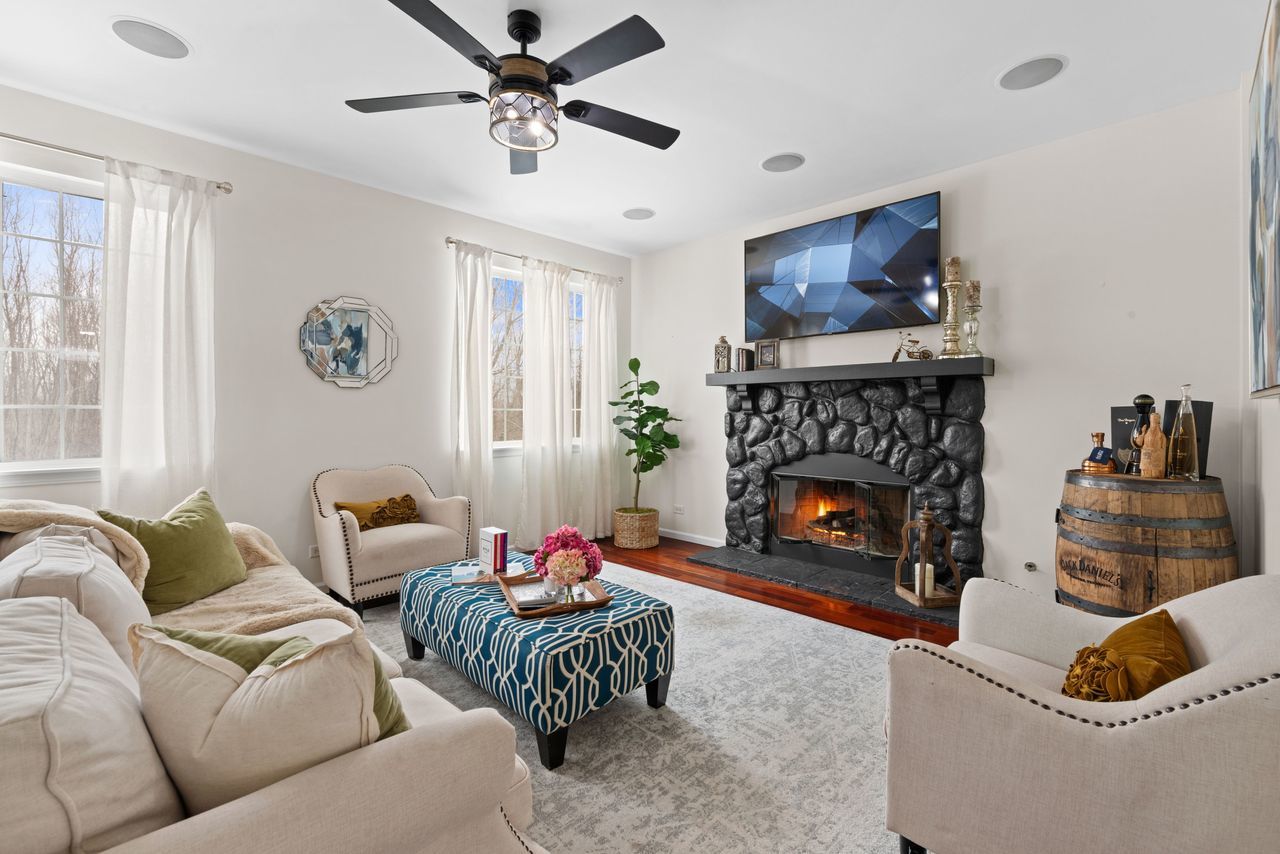 2561 Hennig Road Hampshire, IL 60140 - Photo 5 of 36 a living room with furniture and a fireplace